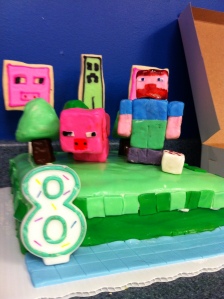 A close-up in which you can see the (saddled) pig and Steve and a wee Minecraft "cake."